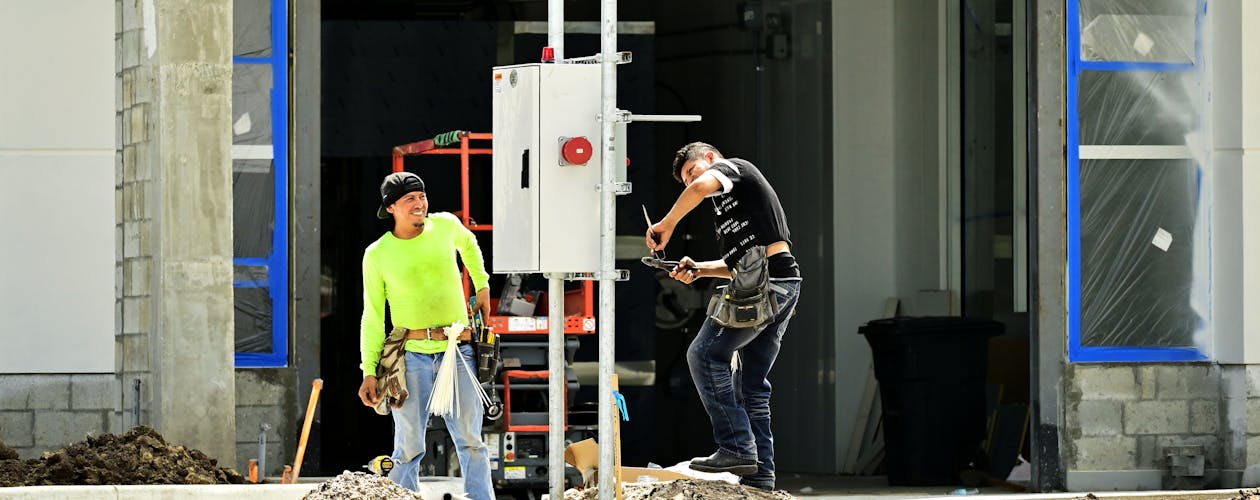 Electrician working on a commercial lighting installation