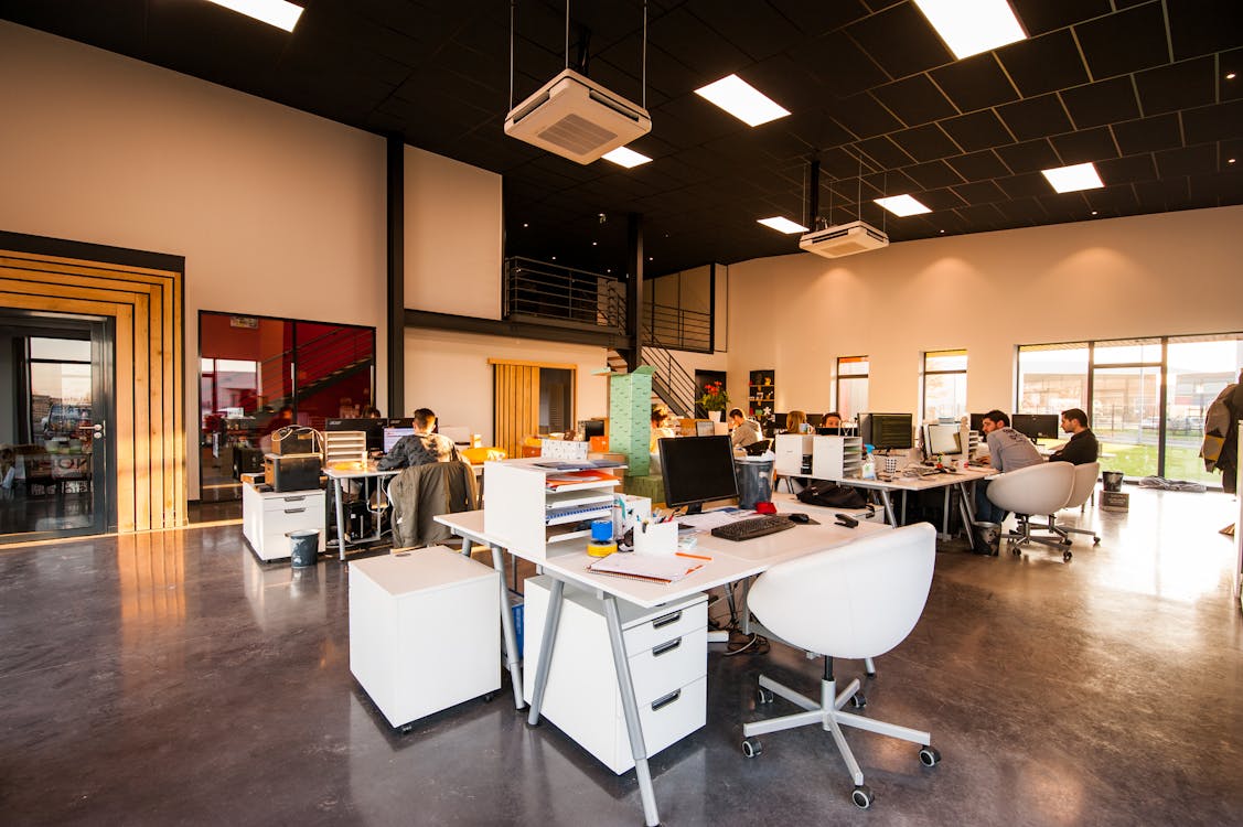 Modern open-plan office with ceiling lighting